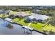 Luxury waterfront home with private dock and lush landscaping at 15546 Viscount Cir, Port Charlotte, FL 33981