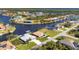 Aerial view of waterfront property and neighborhood at 15546 Viscount Cir, Port Charlotte, FL 33981