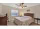 Bedroom with ceiling fan and window at 15546 Viscount Cir, Port Charlotte, FL 33981