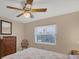 Bedroom with ceiling fan and window at 15546 Viscount Cir, Port Charlotte, FL 33981