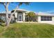 House exterior features landscaping and screened porch at 15546 Viscount Cir, Port Charlotte, FL 33981