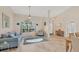 Living room with tiled floors and large window at 15546 Viscount Cir, Port Charlotte, FL 33981