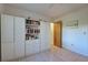 Bedroom with built-in white shelving and storage at 1951 Greenlawn Dr, Englewood, FL 34223