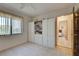 Bedroom with built-in white shelving and storage at 1951 Greenlawn Dr, Englewood, FL 34223