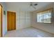 Simple bedroom with built-in shelving and tile flooring at 1951 Greenlawn Dr, Englewood, FL 34223