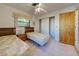 Bright bedroom featuring two twin beds and a spacious closet at 1951 Greenlawn Dr, Englewood, FL 34223