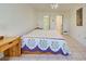 Main bedroom with a double bed and ensuite bathroom access at 1951 Greenlawn Dr, Englewood, FL 34223