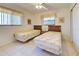 Cozy bedroom with twin beds and ample natural light at 1951 Greenlawn Dr, Englewood, FL 34223