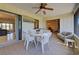 Relaxing screened porch with seating and a dining table at 1951 Greenlawn Dr, Englewood, FL 34223