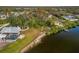 Waterfront property showcasing a house with a pool and expansive lot, offering privacy at 1990-B Bayshore Dr, Englewood, FL 34223