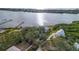 Waterfront property with a house and a large lot with mature trees at 1990-B Bayshore Dr, Englewood, FL 34223