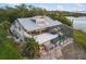 Waterfront property with two-story house, pool, and expansive deck at 1990-B Bayshore Dr, Englewood, FL 34223