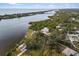 Aerial view of waterfront property with a home and private dock at 1990-B Bayshore Dr, Englewood, FL 34223