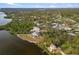 An aerial view of a home on the waterfront with a large lot at 1990-B Bayshore Dr, Englewood, FL 34223