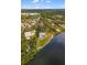 Aerial view of waterfront home with private pool and lush landscaping at 1990-B Bayshore Dr, Englewood, FL 34223