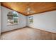 Bright bedroom featuring a ceiling fan and arched window at 1990-B Bayshore Dr, Englewood, FL 34223