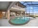 Inviting freeform pool with a large screened enclosure at 1990-B Bayshore Dr, Englewood, FL 34223