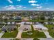 Aerial view of a single story house situated on a canal at 233 Marker Rd, Rotonda West, FL 33947