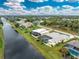 Aerial view showing a single-story house near a canal at 233 Marker Rd, Rotonda West, FL 33947