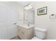 Small bathroom with single vanity and toilet at 233 Marker Rd, Rotonda West, FL 33947