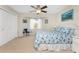 Spacious bedroom with ceiling fan and en-suite bathroom at 233 Marker Rd, Rotonda West, FL 33947