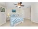 Bright bedroom with ceiling fan and ample closet space at 233 Marker Rd, Rotonda West, FL 33947