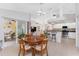 Kitchen dining area with a round table and chairs, near the pool at 233 Marker Rd, Rotonda West, FL 33947