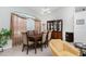 Bright dining room with large window and wood dining set at 233 Marker Rd, Rotonda West, FL 33947