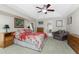 Spacious main bedroom with ceiling fan and plenty of natural light at 233 Marker Rd, Rotonda West, FL 33947