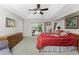 Main bedroom with king-size bed and access to private patio at 233 Marker Rd, Rotonda West, FL 33947