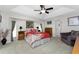 Large main bedroom with a ceiling fan and ensuite bathroom access at 233 Marker Rd, Rotonda West, FL 33947