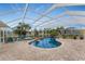 Inviting kidney-shaped pool with screened enclosure at 233 Marker Rd, Rotonda West, FL 33947