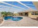 Inviting kidney-shaped pool with screened enclosure at 233 Marker Rd, Rotonda West, FL 33947