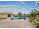 Inviting pool area with a pergola and plenty of space for relaxation at 233 Marker Rd, Rotonda West, FL 33947