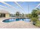 Inviting kidney-shaped pool with screened enclosure at 233 Marker Rd, Rotonda West, FL 33947