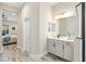 Elegant bathroom with double vanity and a large shower at 26866 Weiskopf Dr, Englewood, FL 34223