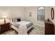 Bedroom with a double bed, nightstand, and dresser at 26866 Weiskopf Dr, Englewood, FL 34223