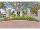 Elegant gated entrance to a residential community at 26866 Weiskopf Dr, Englewood, FL 34223