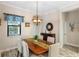 Bright dining room featuring a wood table and chandelier at 26866 Weiskopf Dr, Englewood, FL 34223