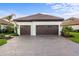 Two-car garage with paver driveway at 26866 Weiskopf Dr, Englewood, FL 34223