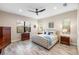 Spacious main bedroom with a comfortable bed and plenty of natural light at 26866 Weiskopf Dr, Englewood, FL 34223