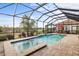 Enclosed pool and spa with tranquil preserve views at 26866 Weiskopf Dr, Englewood, FL 34223