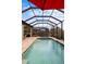 Inviting screened pool and spa area, perfect for relaxation at 26866 Weiskopf Dr, Englewood, FL 34223