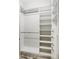 Well-organized walk-in closet with shelves and hanging rods at 26866 Weiskopf Dr, Englewood, FL 34223