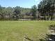 Calm canal view with grassy area at 328 Baytree Dr, Rotonda West, FL 33947