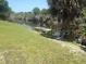 Waterfront view with small dock at 328 Baytree Dr, Rotonda West, FL 33947