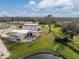 Aerial view of a single-Gathering home with a detached shed and waterfront access at 3302 Bluejay Ln, Englewood, FL 34224