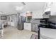 Modern kitchen featuring stainless steel appliances and white cabinets at 3302 Bluejay Ln, Englewood, FL 34224