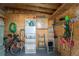 Well-organized storage room with shelving, tools, and space for bikes at 3302 Bluejay Ln, Englewood, FL 34224