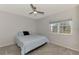 Bright bedroom with carpeted floor, double bed and ceiling fan at 3460 Lullaby Rd, North Port, FL 34287